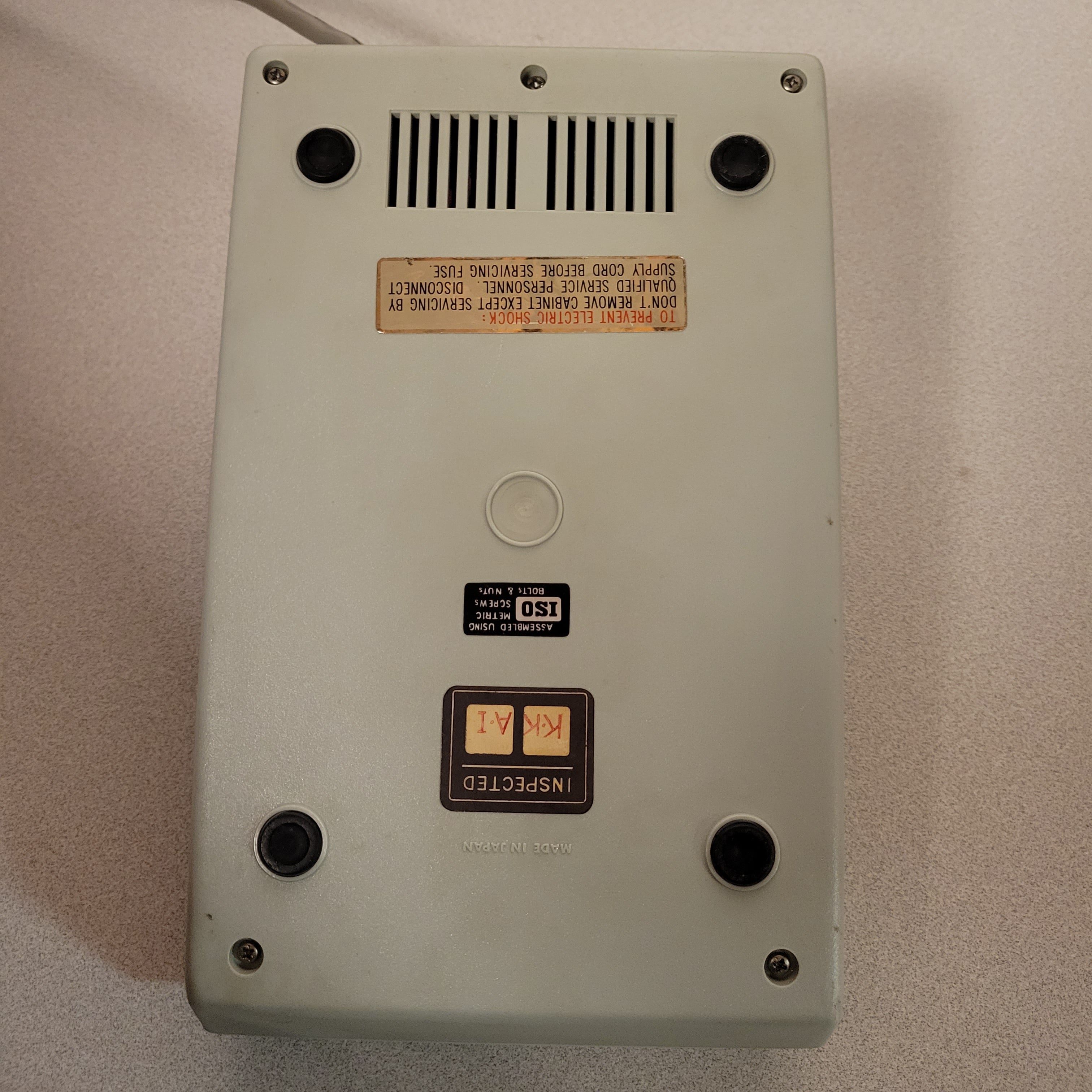 An image of the bottom of a Burroughs C 3155 desktop calculator